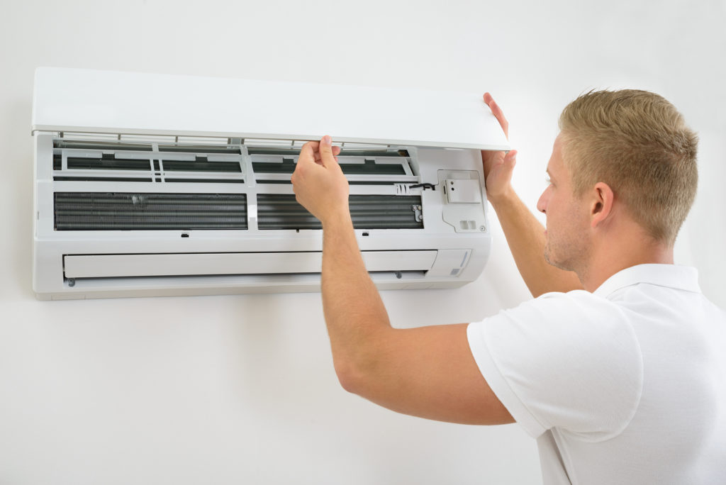 bigstock Man Adjusting Air Conditioning